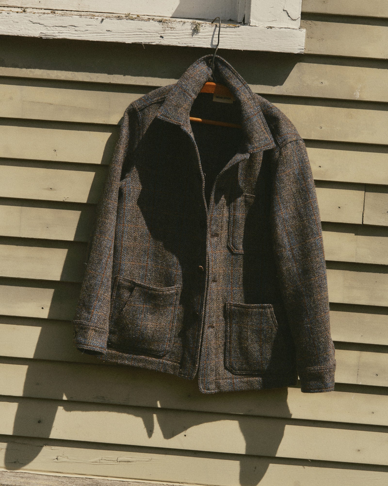 fit model buttoning up The Ojai Jacket in Rust Check Harris Tweed Wool, Outerwear by Taylor Stitch