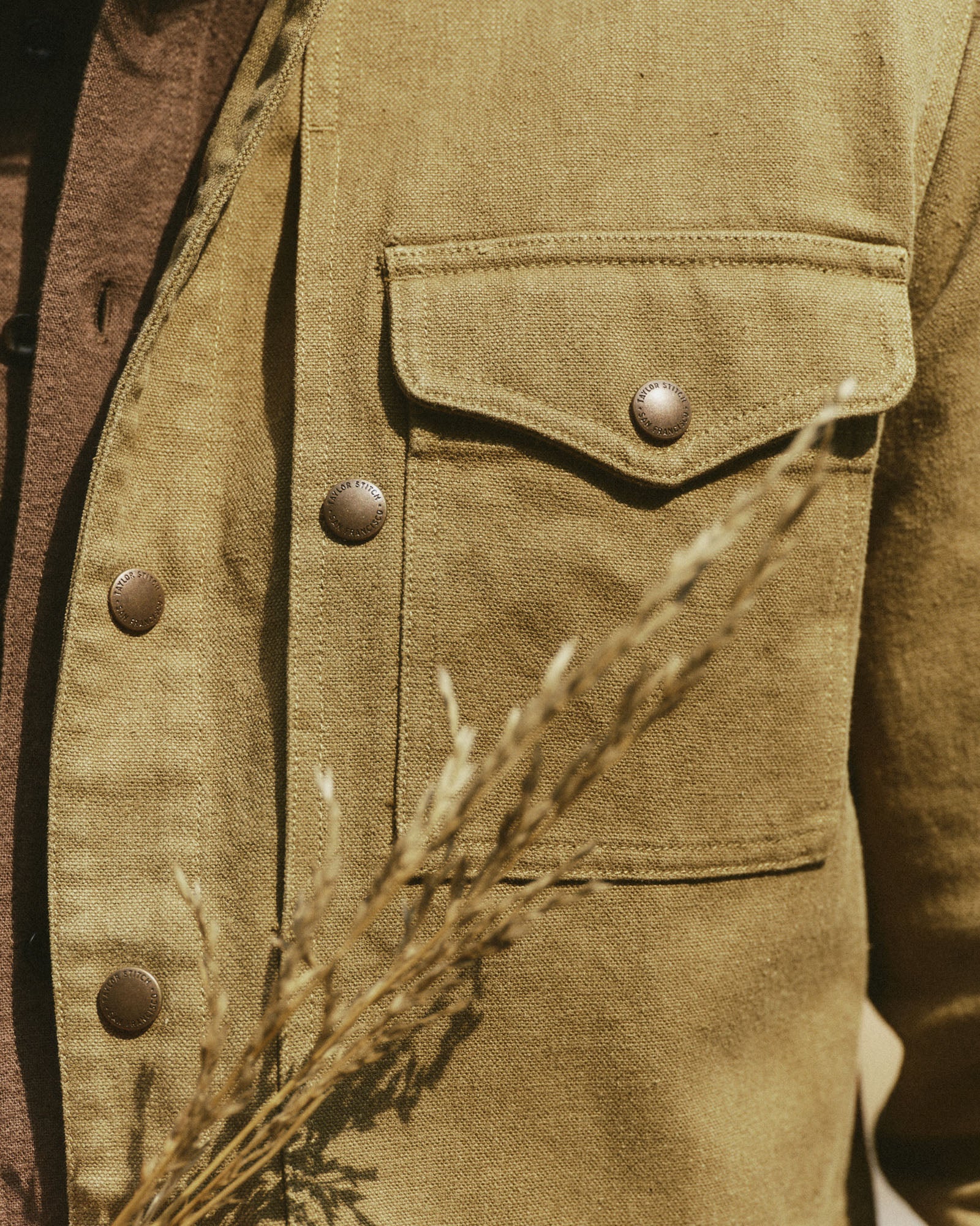 material shot of the pocket on The Pacific Overshirt in Bay Leaf Hemp Canvas, Wovens by Taylor Stitch