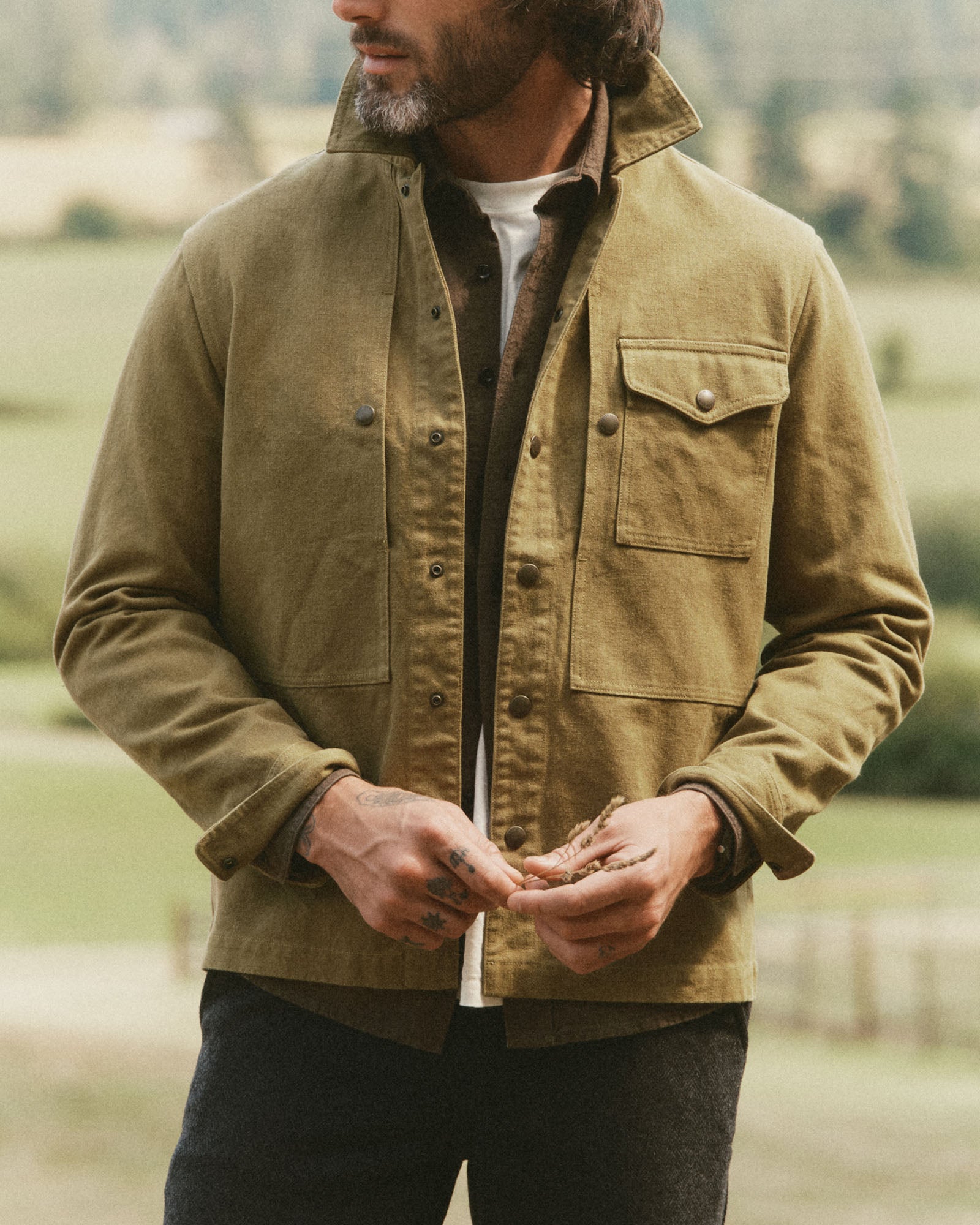 fit model posing in The Pacific Overshirt in Bay Leaf Hemp Canvas, Wovens by Taylor Stitch
