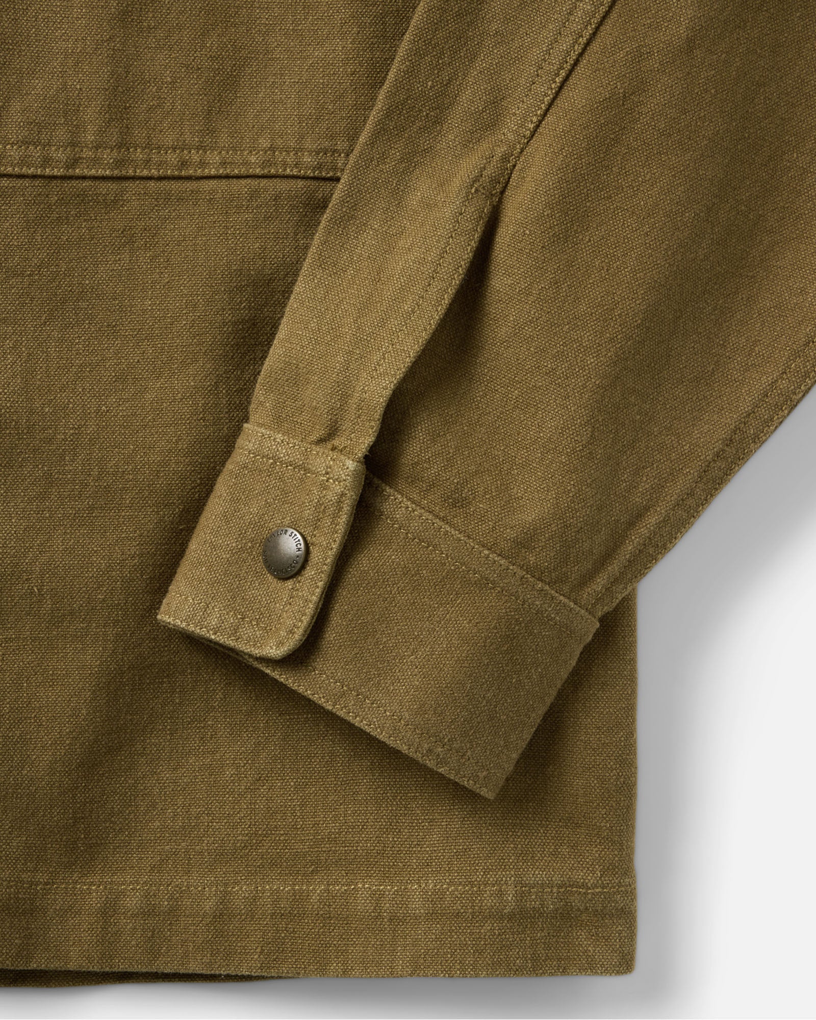material shot of the sleeve on The Pacific Overshirt in Bay Leaf Hemp Canvas, Wovens by Taylor Stitch