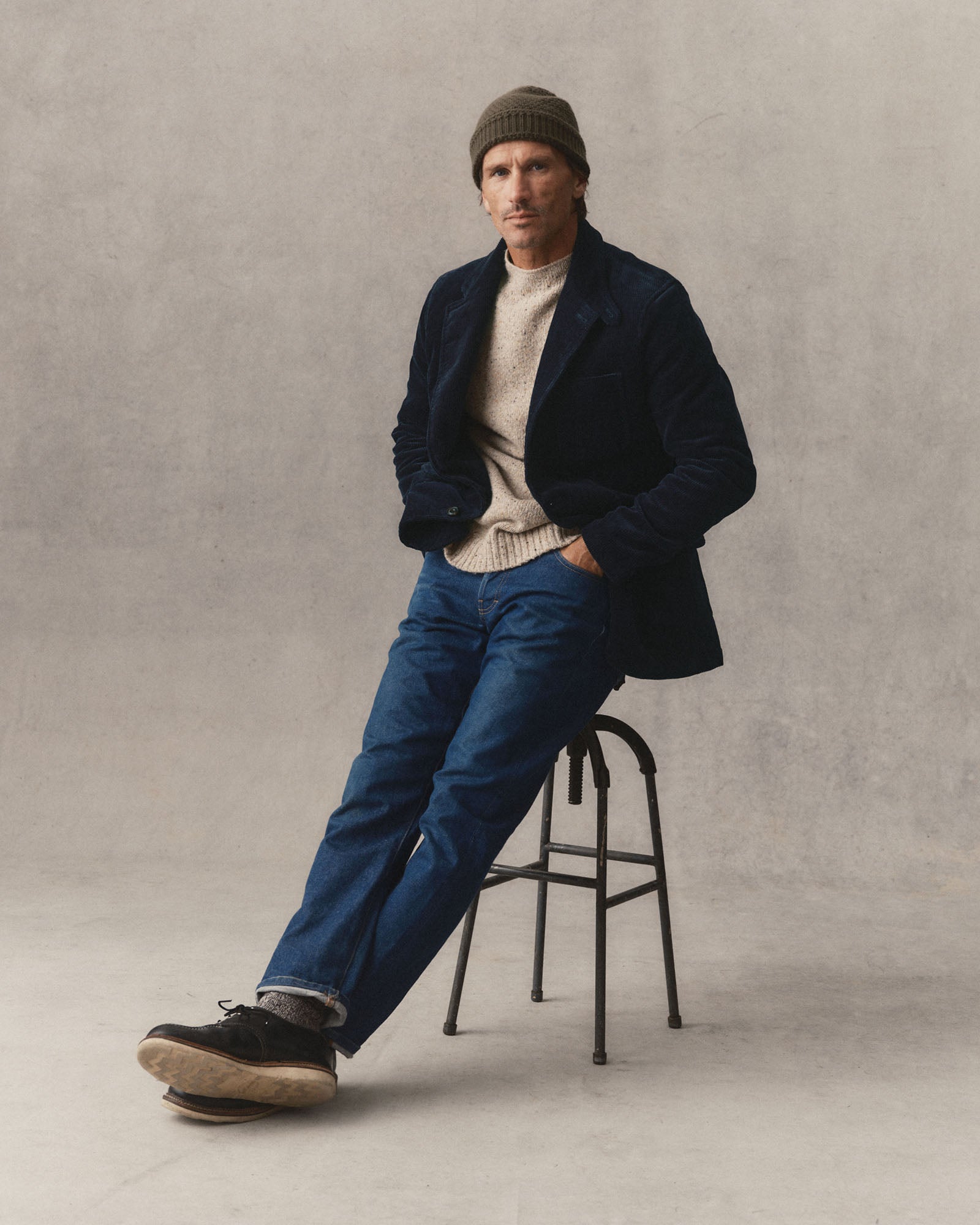 fit model sitting wearing The Riley Sportcoat in Dark Navy Corduroy, Outerwear by Taylor Stitch