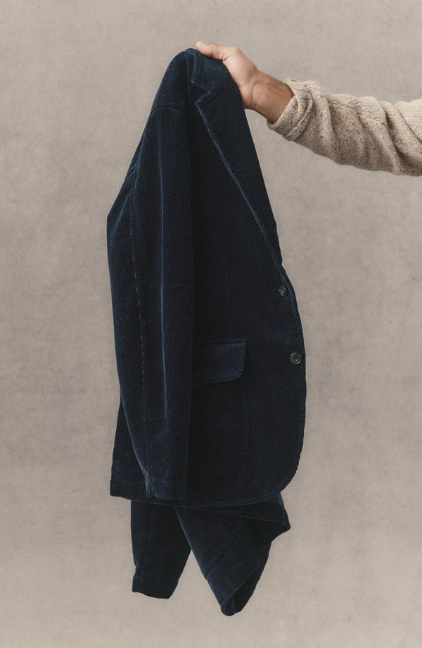 fit model holding The Riley Sportcoat in Dark Navy Corduroy