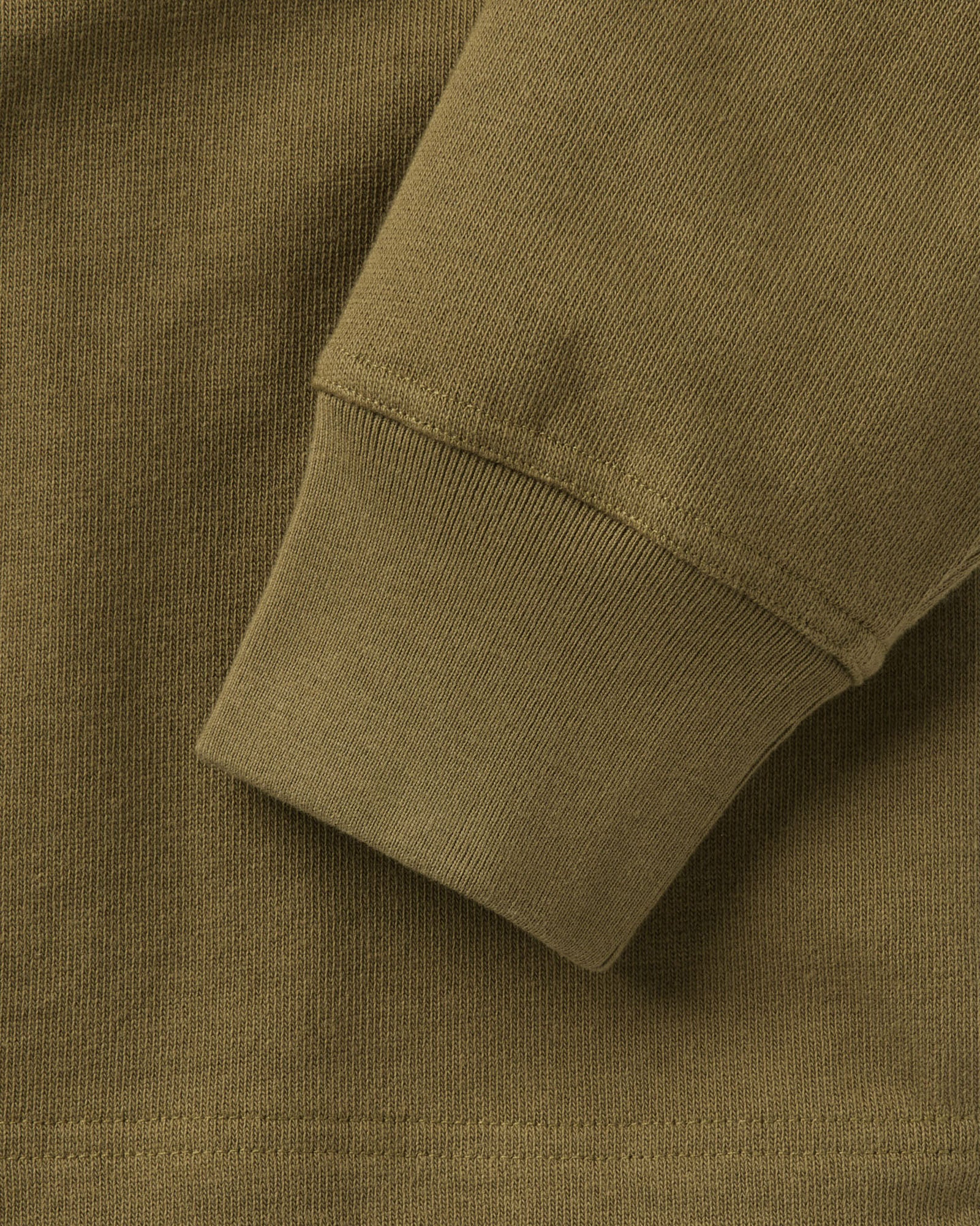 material shot of the sleeve on The Rugby Shirt in Dry Sage, Knits by Taylor Stitch
