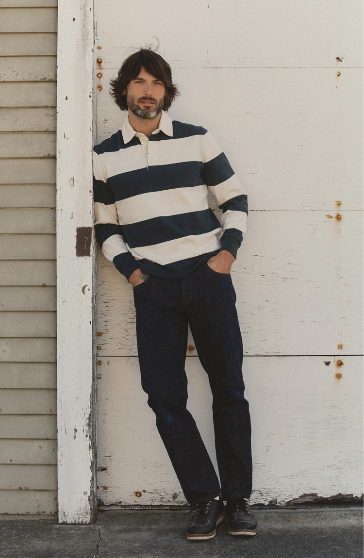 fit model posing in The Rugby Shirt in Navy Stripe