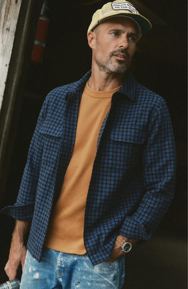 fit model posing in The Shore Shirt in Midnight Check Wool