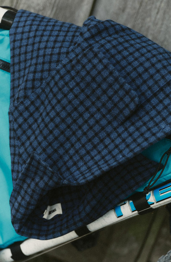 editorial image of The Shore Shirt in Midnight Check Wool on a bike