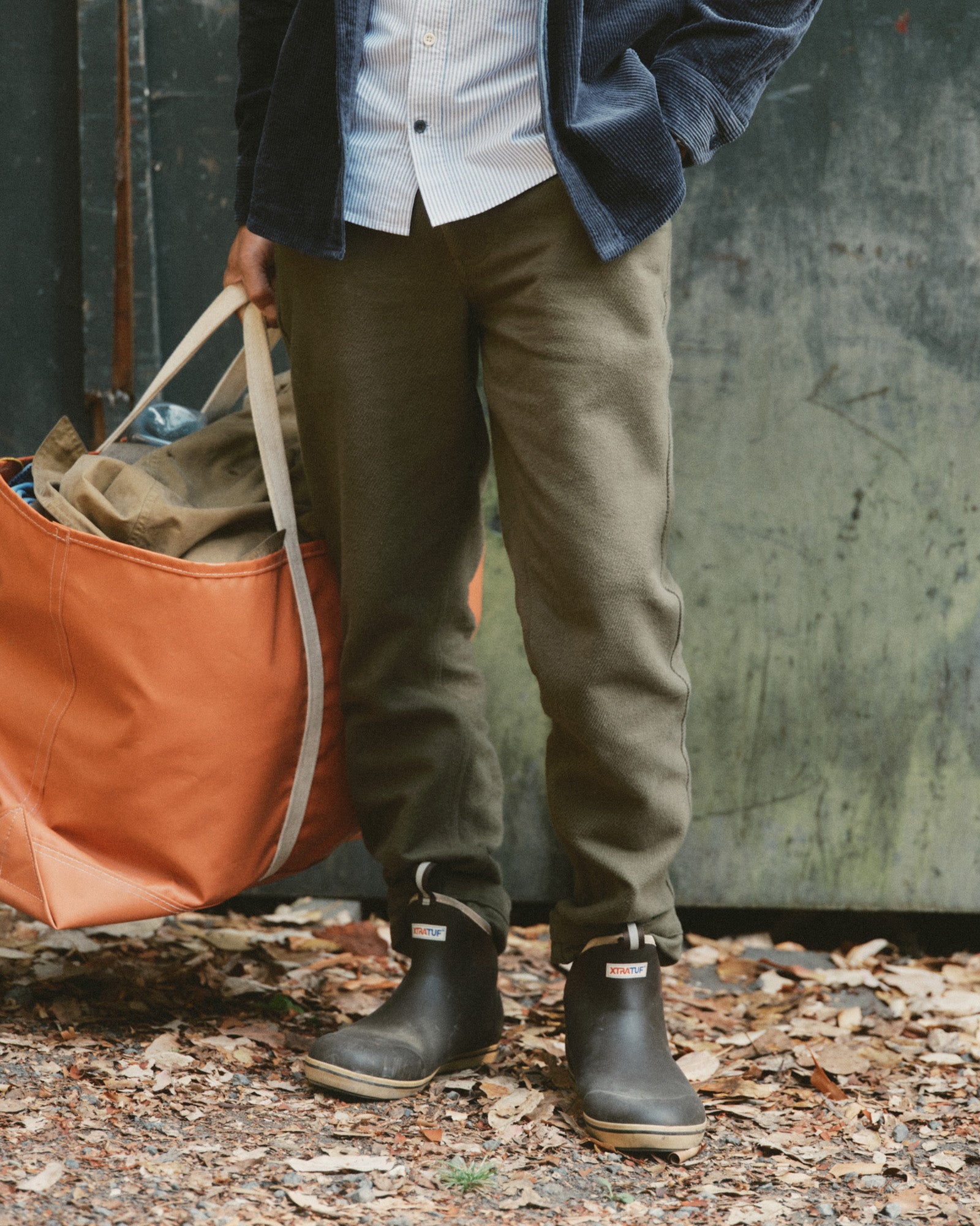 fit model posing in The Carnegie Pant in Fatigue Olive Washed Moleskin, Bottoms by Taylor Stitch