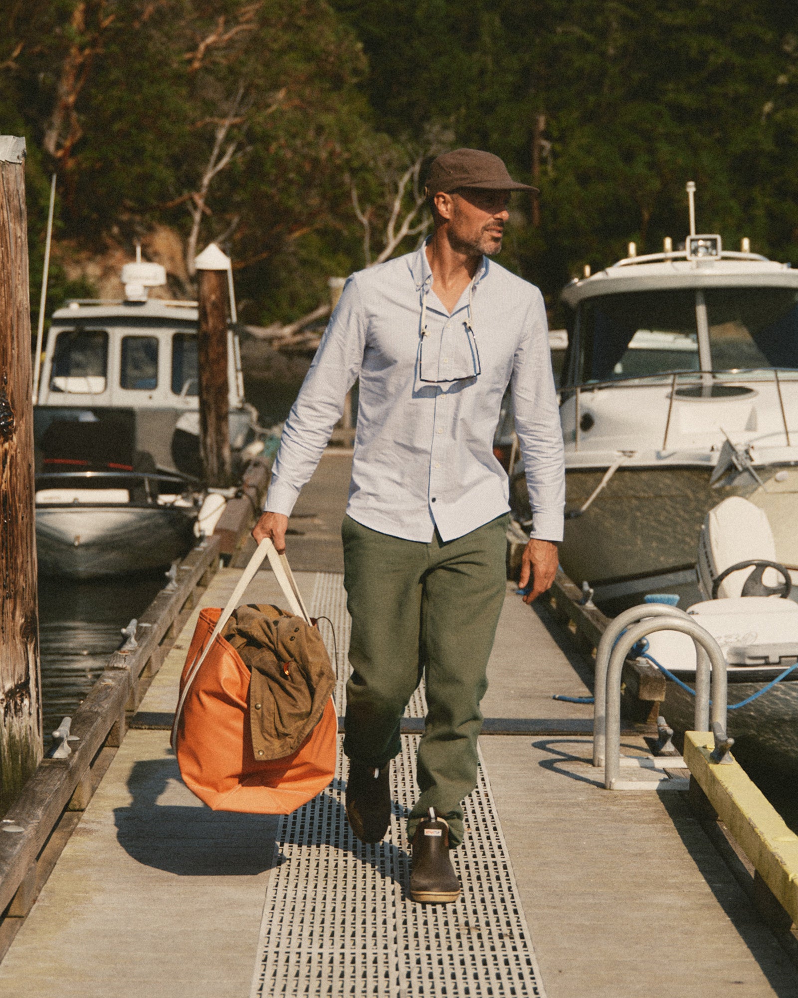 fit model walking wearing The Carnegie Pant in Fatigue Olive Washed Moleskin, Bottoms by Taylor Stitch