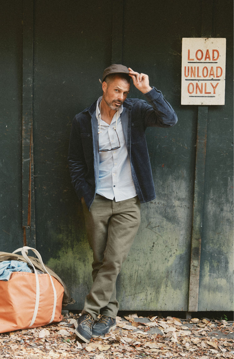 fit model posing in The Carnegie Pant in Fatigue Olive Washed Moleskin