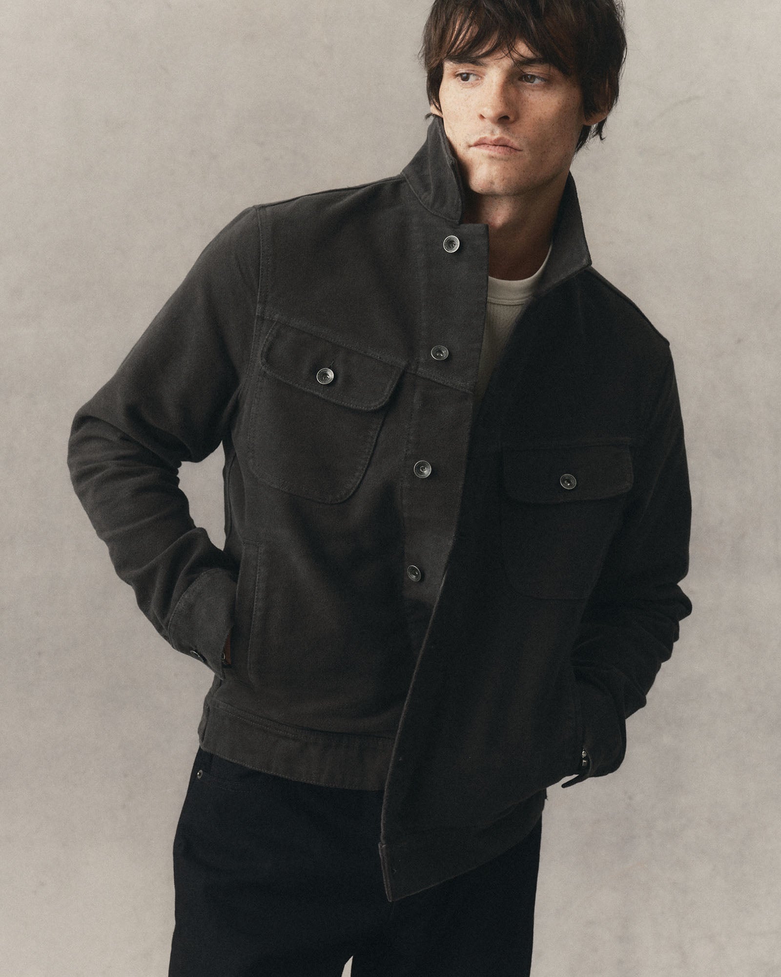 fit model showing off The Long Haul Jacket in Faded Black Washed Moleskin, Outerwear by Taylor Stitch