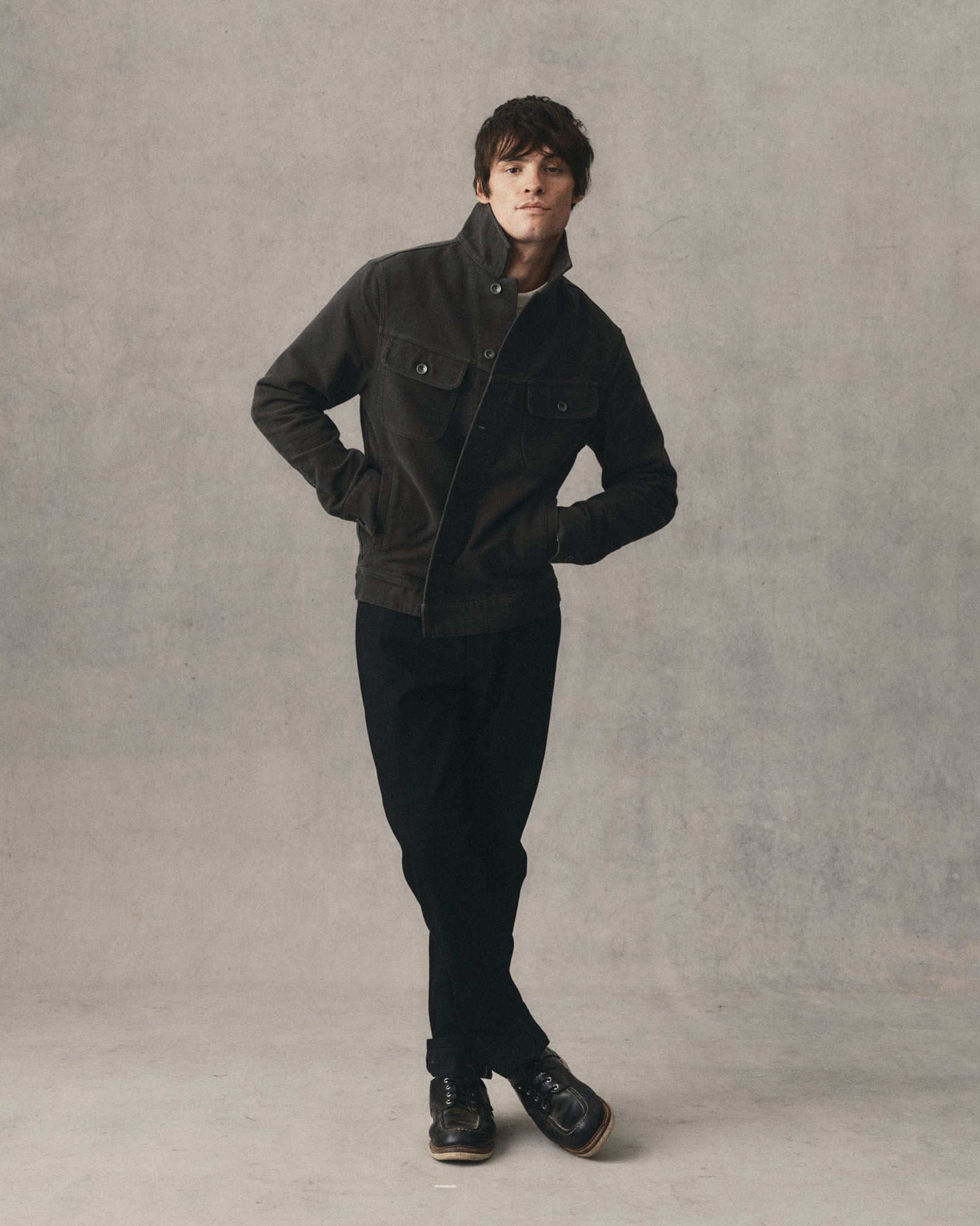 fit model posing in The Long Haul Jacket in Faded Black Washed Moleskin, Outerwear by Taylor Stitch