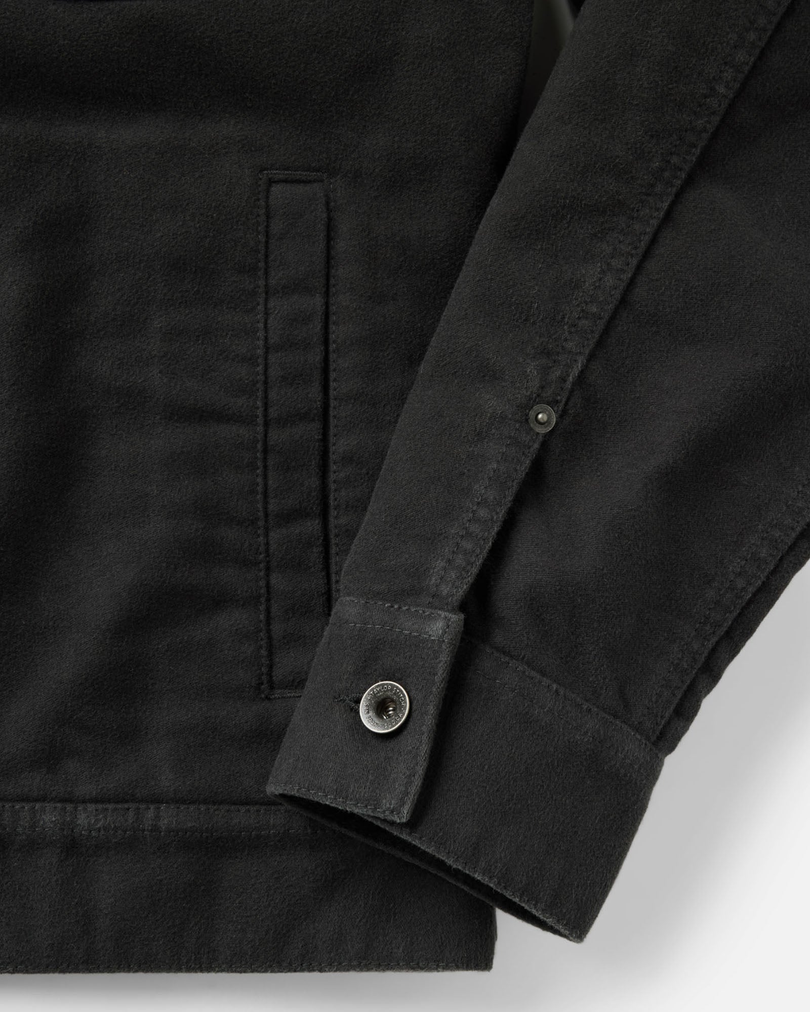 material shot of the sleeve on The Long Haul Jacket in Faded Black Washed Moleskin, Outerwear by Taylor Stitch