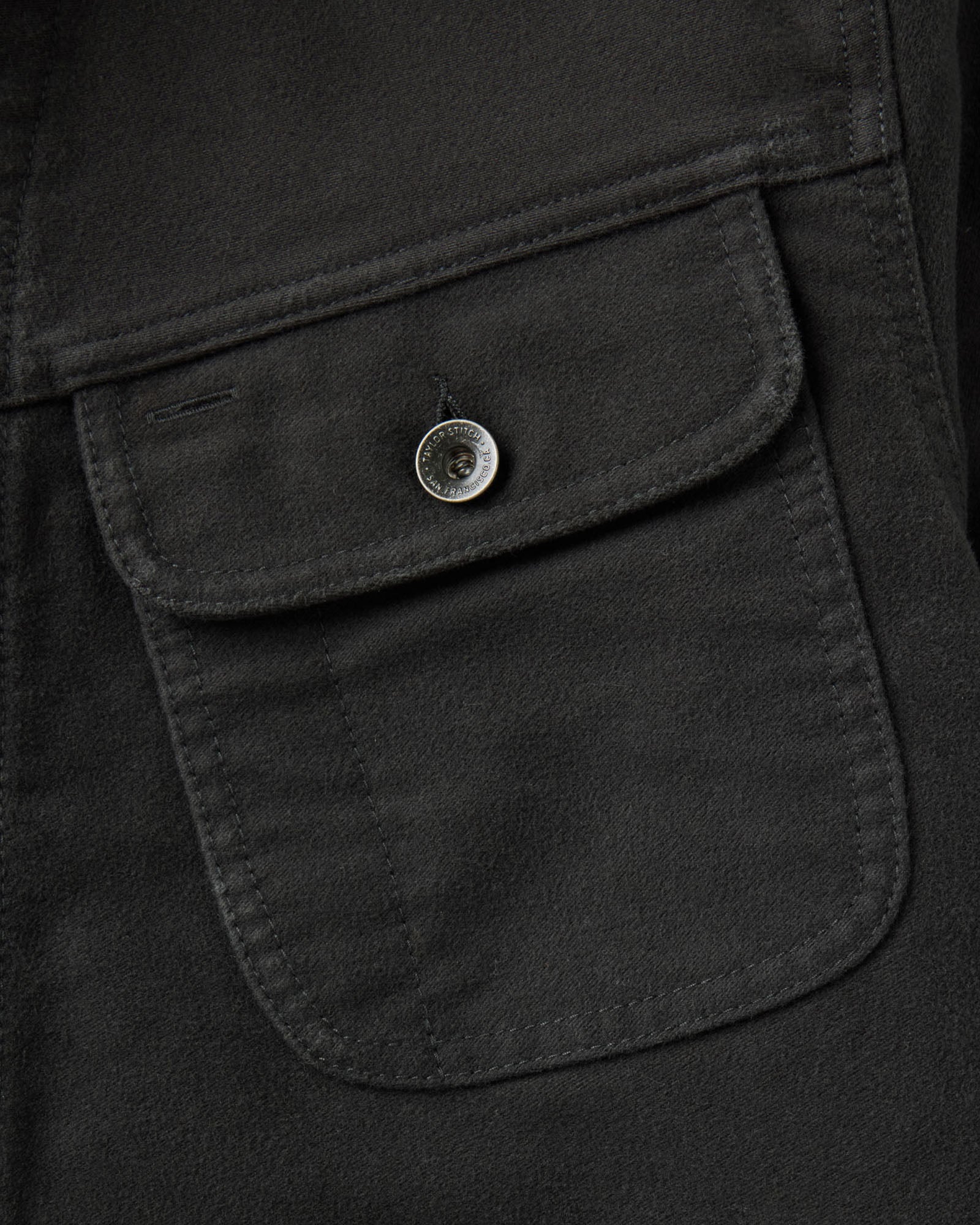 material shot of the pocket on The Long Haul Jacket in Faded Black Washed Moleskin, Outerwear by Taylor Stitch