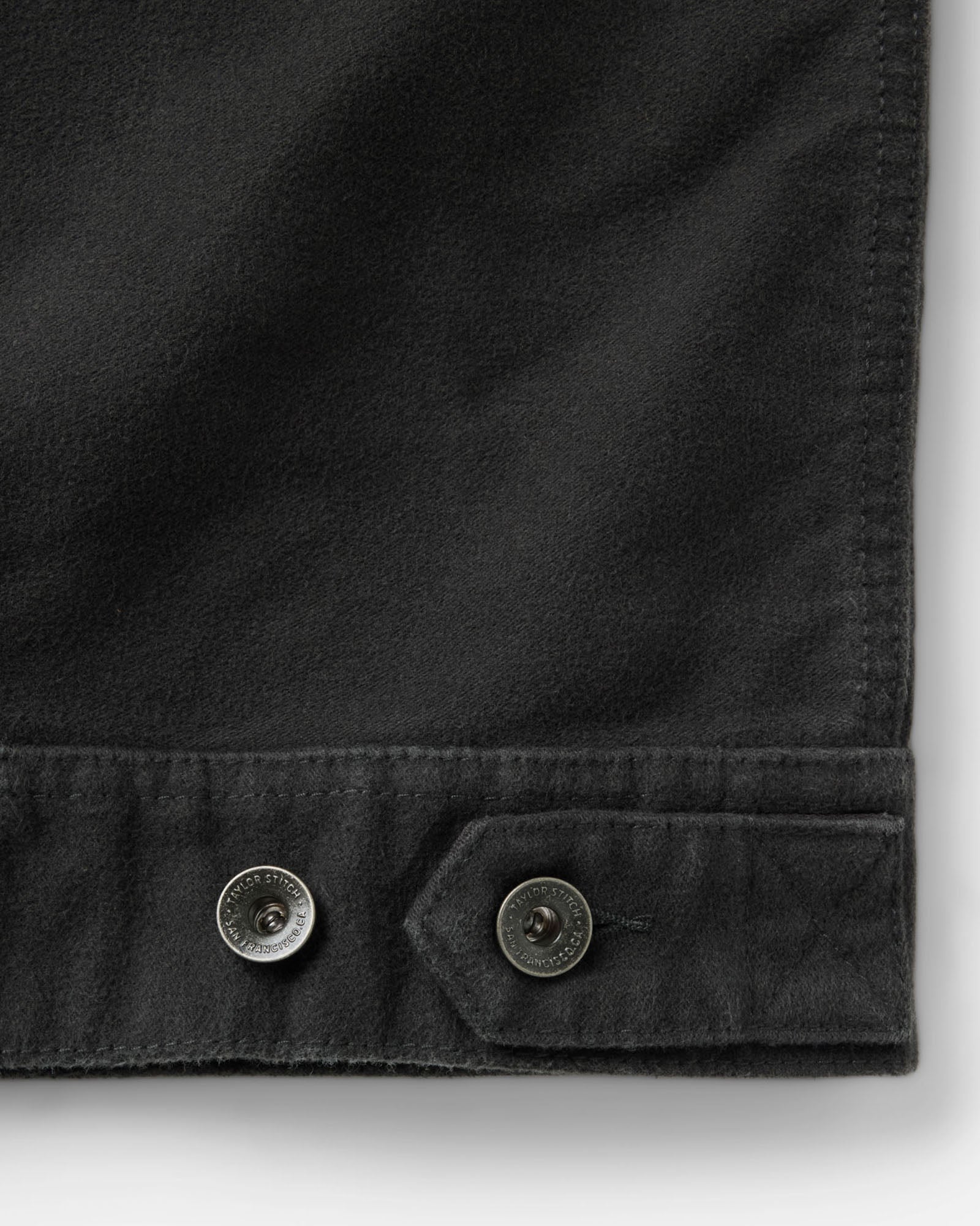 material shot of the back pockets on The Long Haul Jacket in Faded Black Washed Moleskin, Outerwear by Taylor Stitch