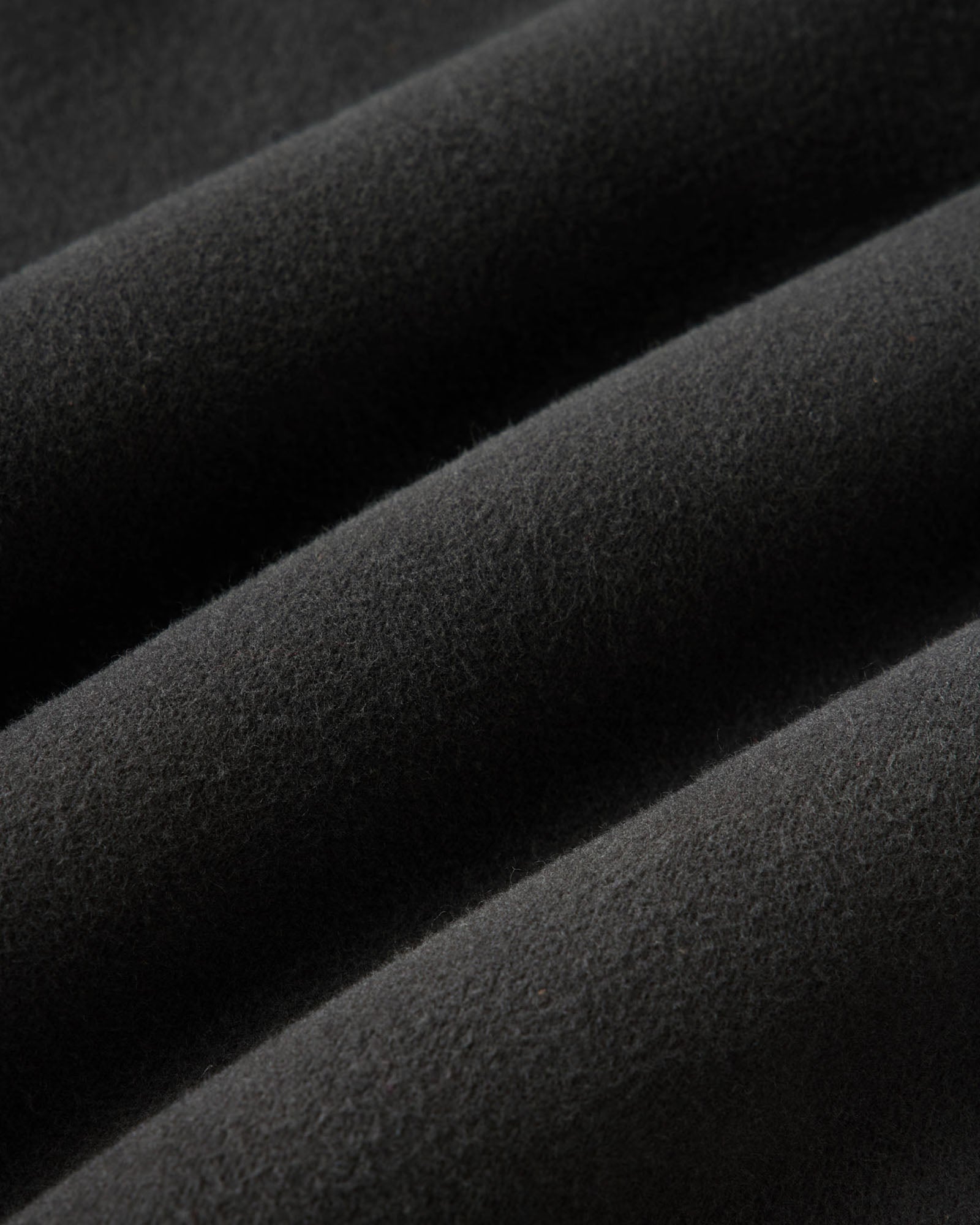 material shot of the fabric on The Long Haul Jacket in Faded Black Washed Moleskin, Outerwear by Taylor Stitch