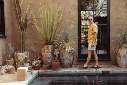 Fit model walking in The Apres Short in Morita Stripe and The Short Sleeve Hawthorne in Wheat