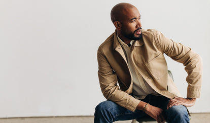 fit model sitting wearing The Ojai Jacket in Light Khaki Foundation Twill 