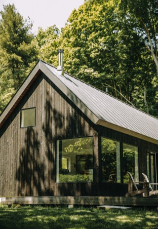 Exterior of the wooden and glass barn