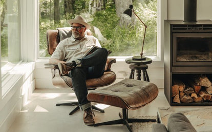 Mark Holthusen sitting on an Eames chair