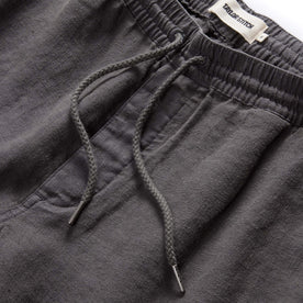 material shot of the drawcords on The Apres Short in Granite Hemp