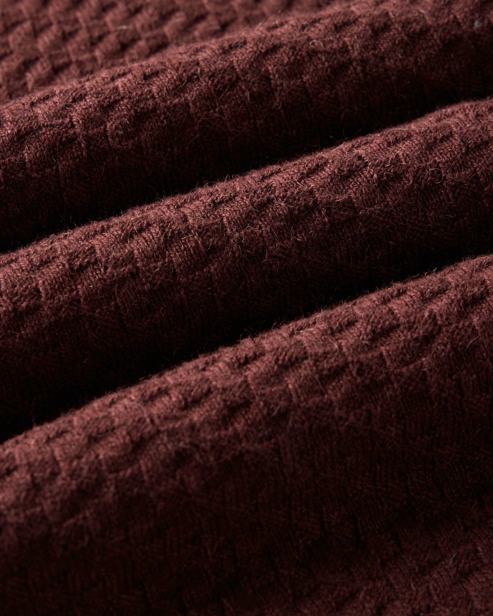 material shot of the fabric on The Arlo Sweater Polo in Burgundy Texture Knit, Knits by Taylor Stitch