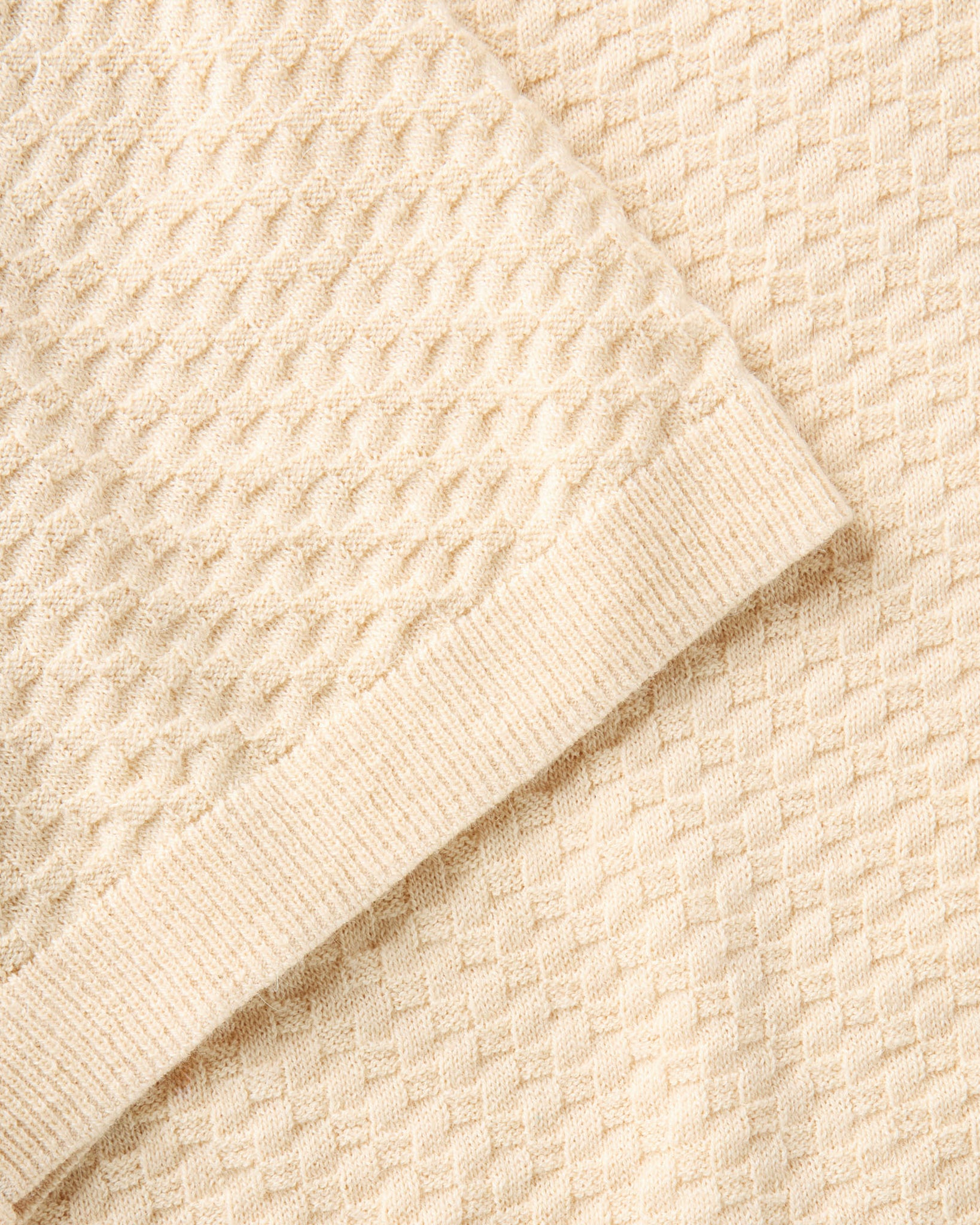 material shot of the sleeve on The Arlo Sweater Polo in Oat Texture Knit, Knits by Taylor Stitch