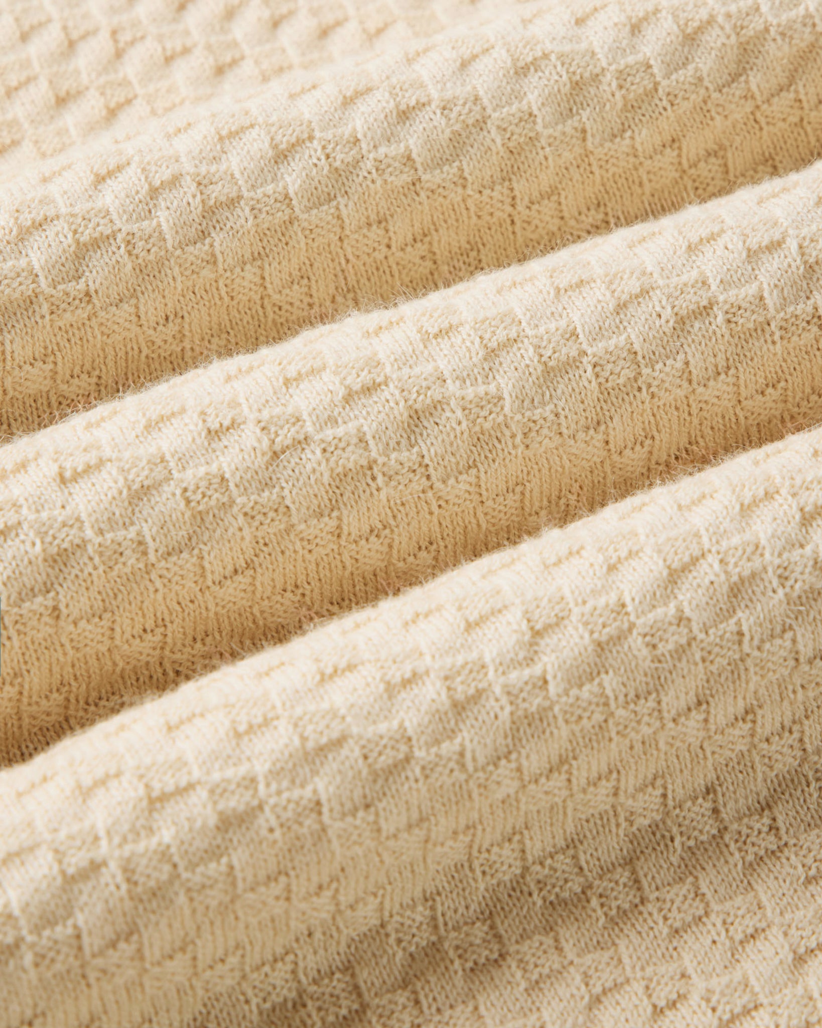 material shot of the fabric on The Arlo Sweater Polo in Oat Texture Knit, Knits by Taylor Stitch