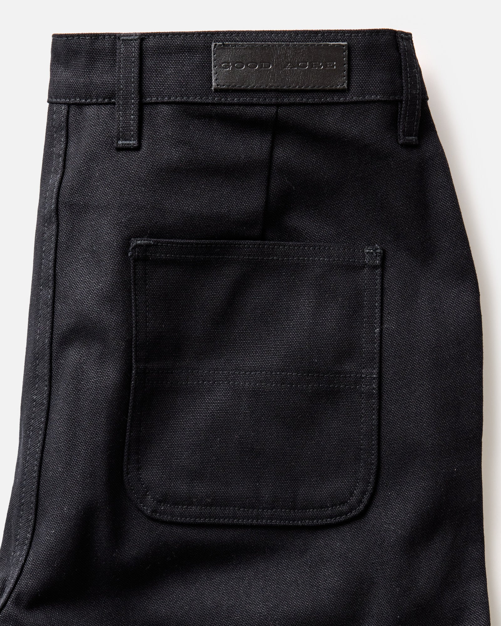 material shot of the back pocket on The Good Acre Chore Pant in Black Canvas, Bottoms by Taylor Stitch