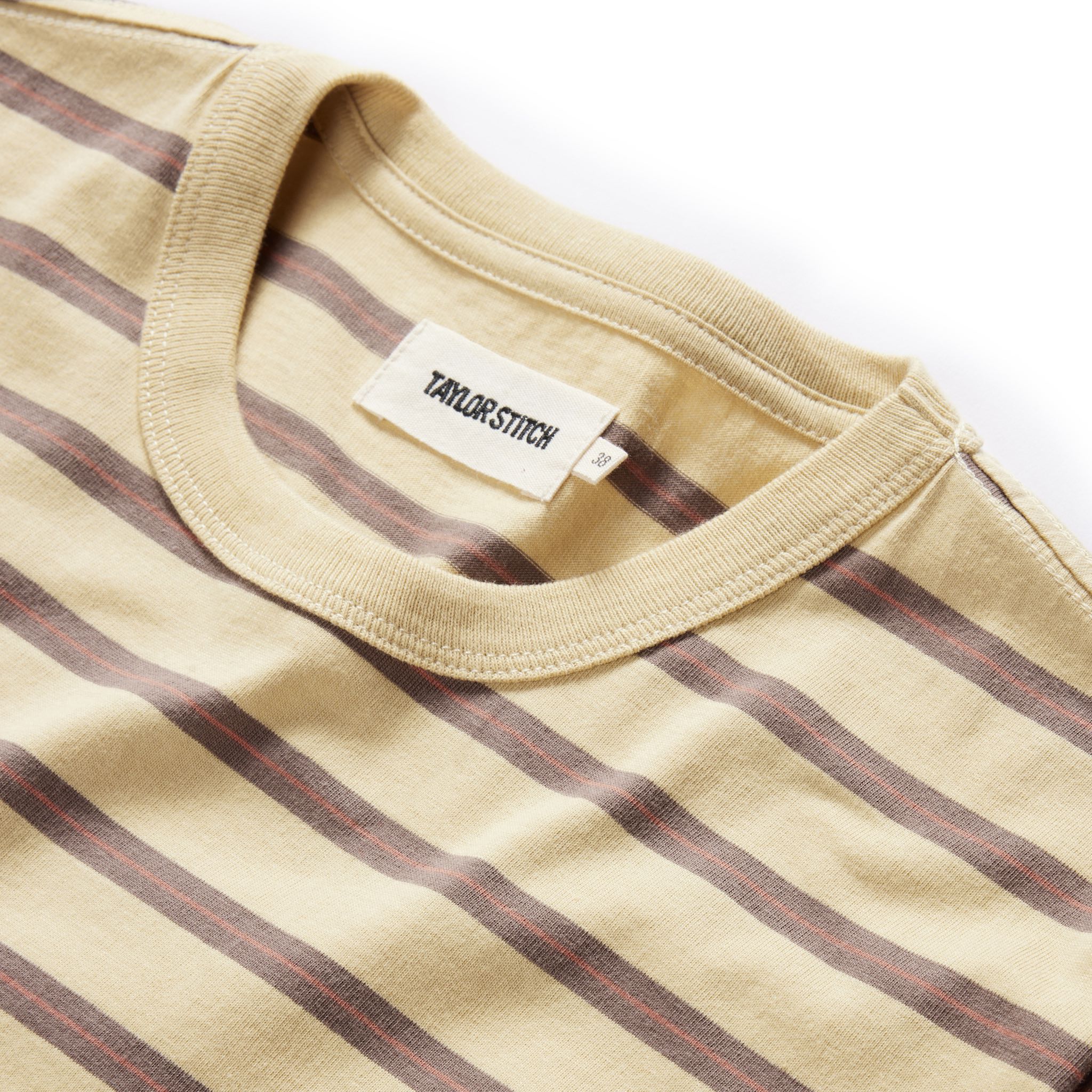 material shot of the neck opening on The Organic Cotton Tee in Vintage Gold Stripe, Knits by Taylor Stitch