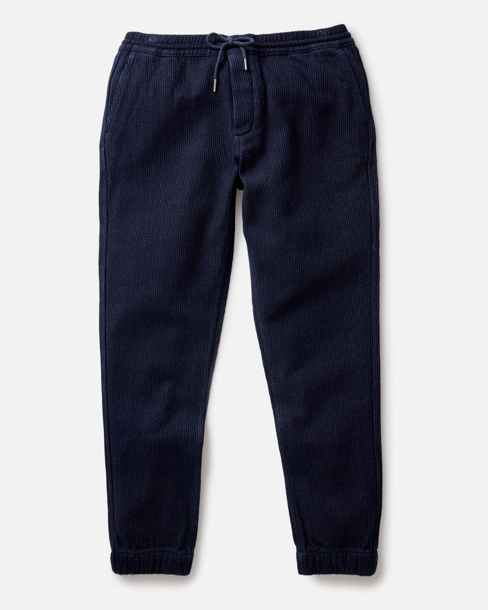 flatlay of The Apres Pant in Rinsed Indigo Sashiko, Bottoms by Taylor Stitch