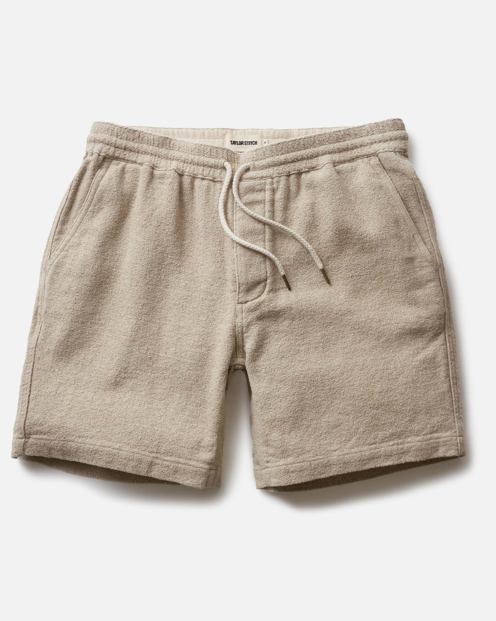 flatlay of The Apres Short in Heather Oat Crepe, Bottoms by Taylor Stitch