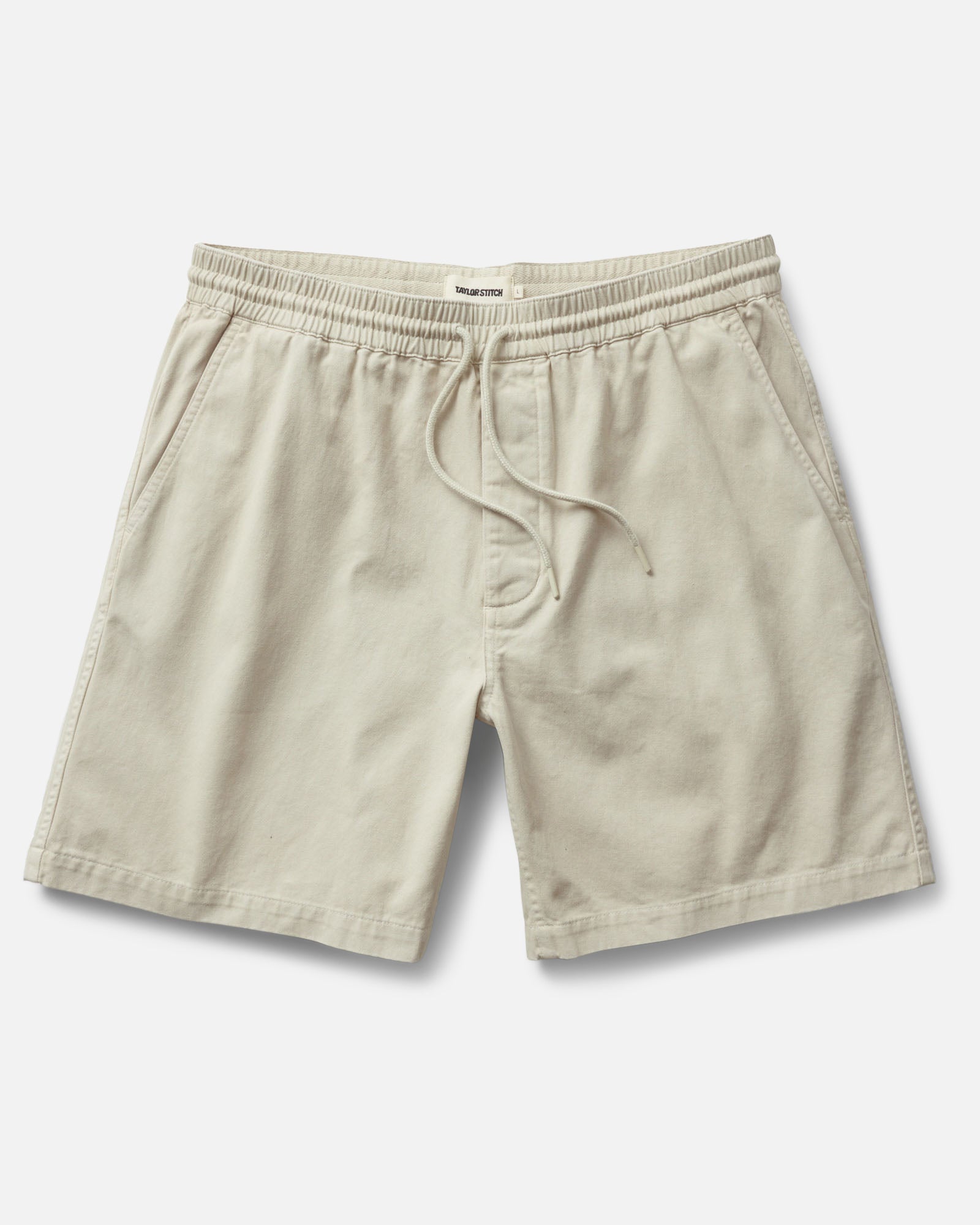 flatlay of The Apres Short in Organic Aged Stone Foundation Twill, Bottoms by Taylor Stitch