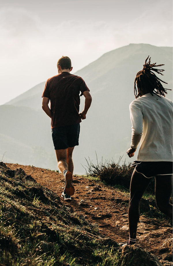 our guys running on a trail.