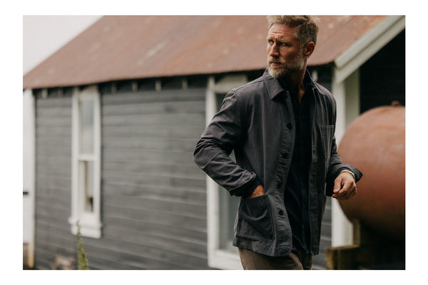 fit model walking wearing The Ojai Jacket in Charcoal Foundation Twill