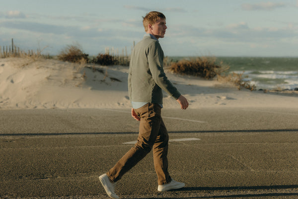 fit model walking wearing The Organic Cotton Crew in Deep Sea Waffle