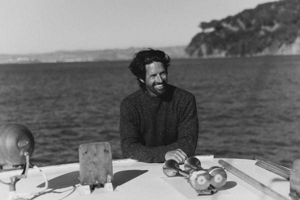 fit model posing in The Seafarer Sweater in Navy