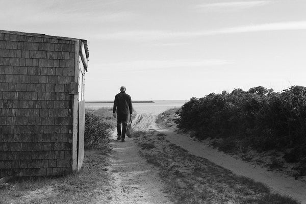 fit model walking wearing The Shop Shirt