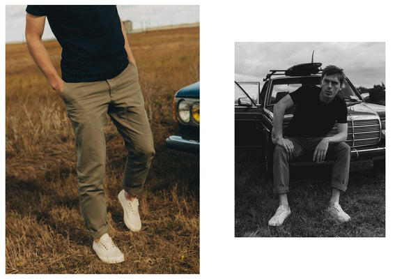 fit model sitting wearing The Slim Foundation Pant in Organic Smoked Olive