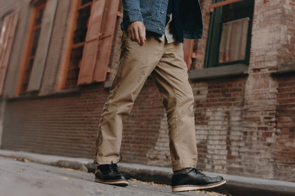 fit model walking wearing The Straight Foundation Pant in Organic Khaki