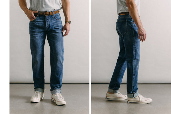Split shot showing our guy from the front and back, in slim fit selvedge jeans and a plain white tee.