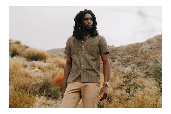 Model wearing The Conrad Camp Shirt in Fatigue Olive Dobby