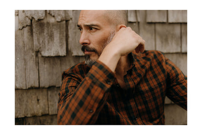 fit model posing in flannel shirt