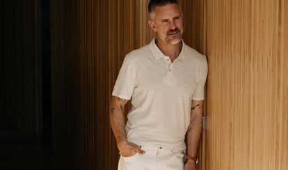 fit model posing in The Cotton Hemp Polo in Heather Oat