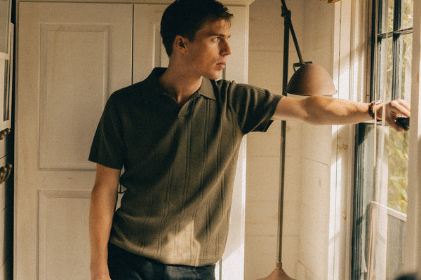 fit model posing in The Valencia Sweater Polo in CIlantro Rib