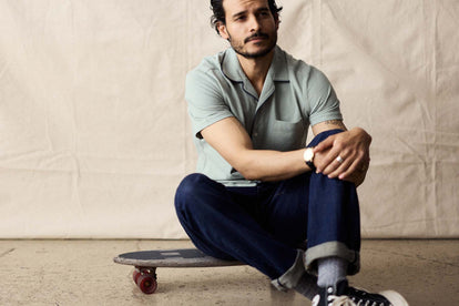 fit model sitting wearing The Harwich Shirt in Surf Green Tipped Pique