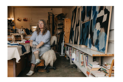 Editorial image of Carrie Crawford sitting in her studio