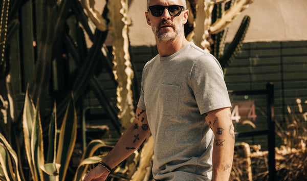 fit model walking wearing The Heavy Bag Tee in Aluminum