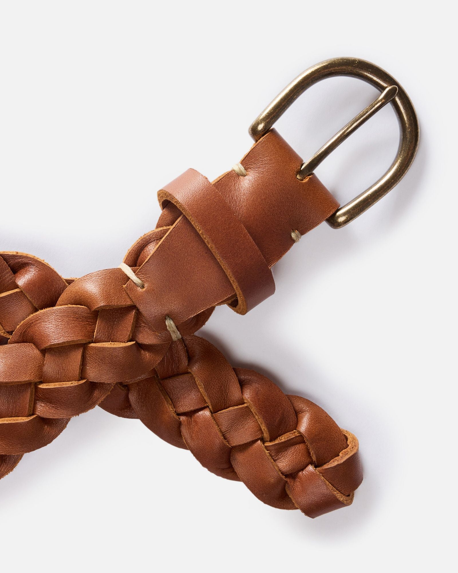 editorial image of a buckle and the end of The Braided Belt in Whiskey, Accessories by Taylor Stitch