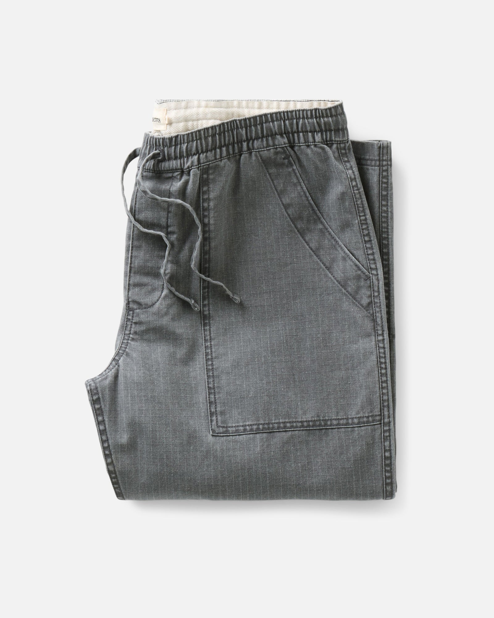 folded flatlay of The Breakwater Pant in Dark Grey Ripstop, Bottoms by Taylor Stitch