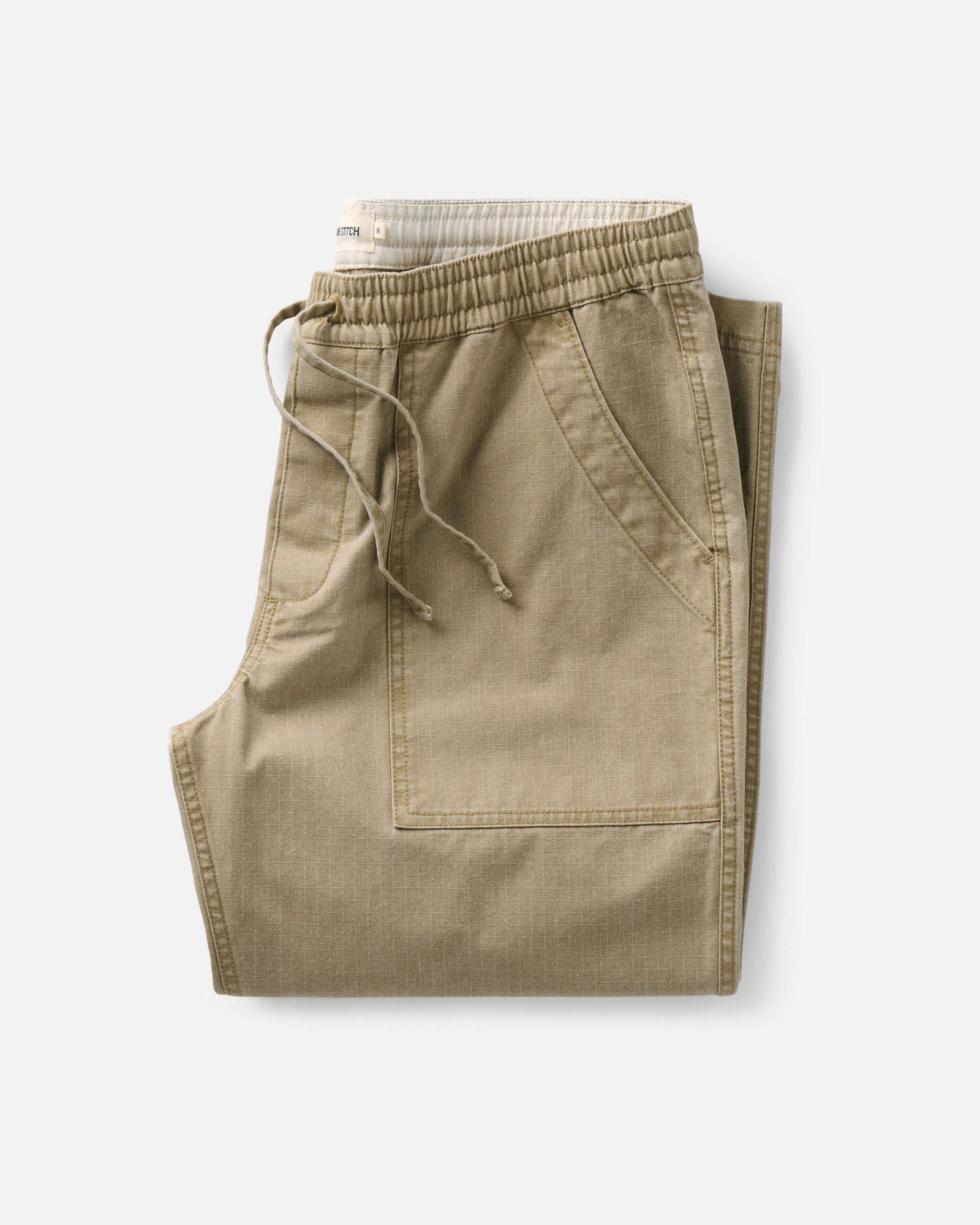 folded flatlay of The Breakwater Pant in Field Khaki Ripstop, Bottoms by Taylor Stitch